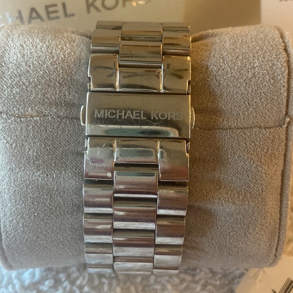 Michael Kors watch with crystals on the face. Silver tone. Stainless steel.